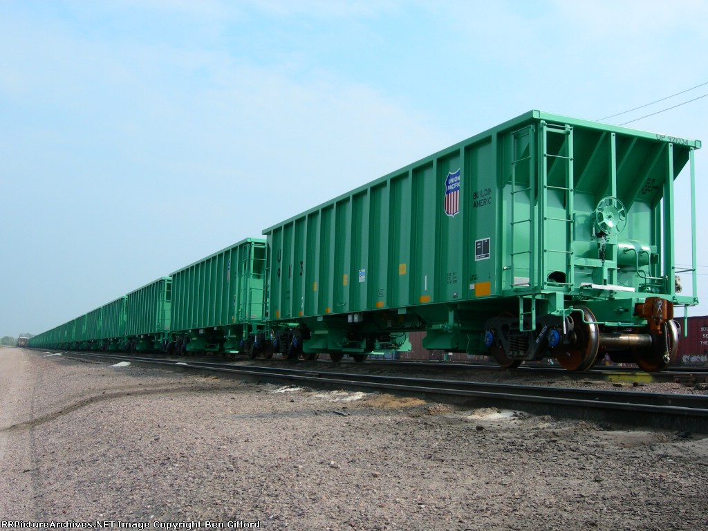 1/4 Mi. of new ballast cars in UP yard